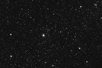 A mesmerizing image capturing the beauty of the universe at night, filled with twinkling stars, an astronomical object, and mystical constellation patterns. 