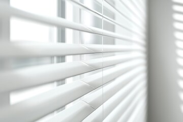 A close-up shot of white window blinds