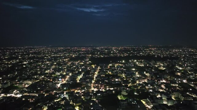 An aerial view of Dehradun, a smart Indian city. The top-angle views of the city's residential houses in Dehradun, Uttarakhand, India. A beautiful city in India at night.