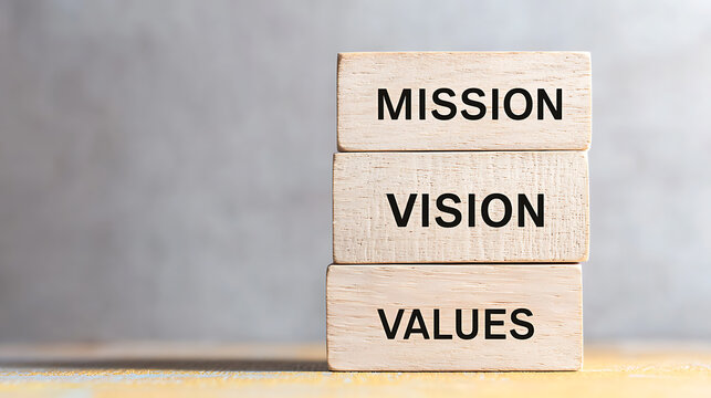 Mission, Vision, Values: Stacked blocks highlighting core concepts. Strategy, leadership, goals and purpose, guiding principles for success.