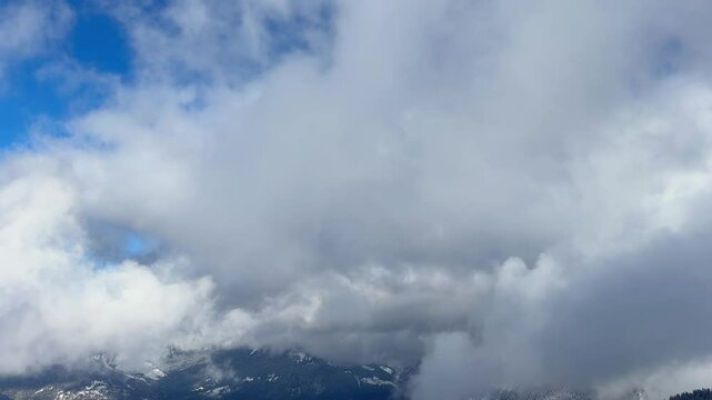 horizontal video of French Alps covered by clouds and snow 