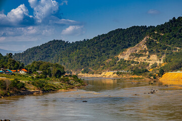 Aerial view of the high mountains and the Mekong River, is nestled in the high mountains and tropical rainforest.