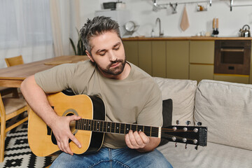 Obraz premium Cozy evening at home with heartfelt guitar melodies filling the warm interior