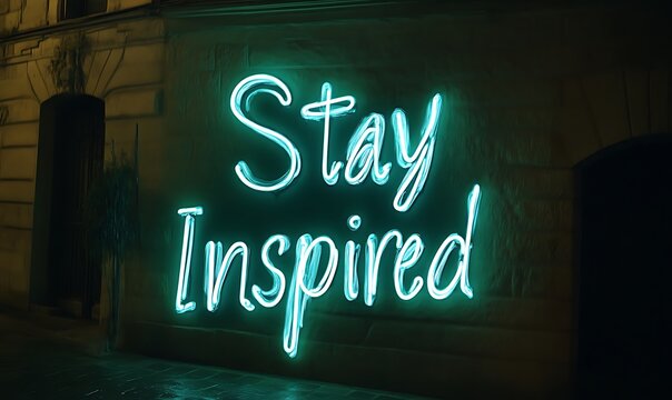 Teal Neon Stay Inspired Sign on Building Wall at Night - Powered by Adobe