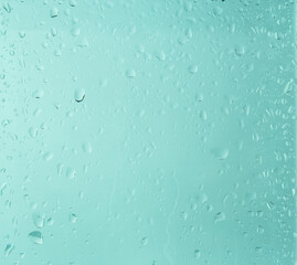 Texture of water drops on a glass window. Pastel water green or blue green background, with a color gradient. Raindrop and droplets on transparent surface.