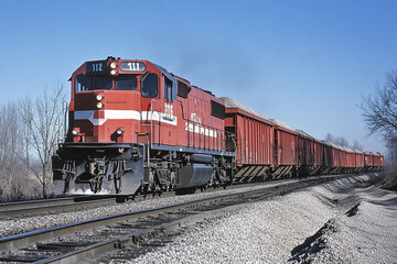 Fototapeta premium Red freight train transports cargo along the railway. Generative AI