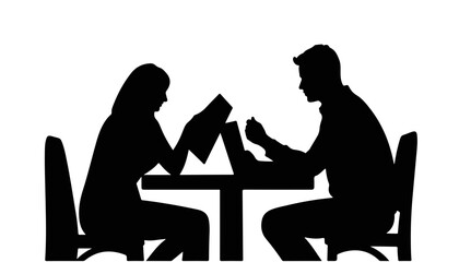 Silhouetted couple reading menus at a table
