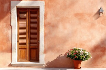 Warm terracotta wall features wooden shuttered door and vibrant