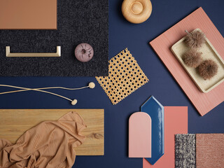 Sophisticated navy and blush color scheme with geometric tiles, woven rattan, and natural wood...