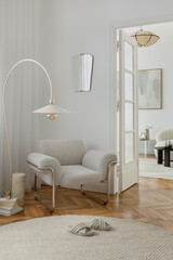 Cozy reading corner with a boucle armchair, soft lighting, and layered natural textures.