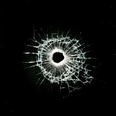 Broken glass with central impact and radial cracks on a black background, highlighting details of the fractured crystal. Shattered glass texture with light effects on the cracks