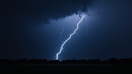 A massive lightning bolt illuminating a stormy night sky over a rural landscape,