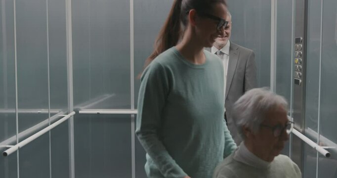 Diverse people talking in the elevator