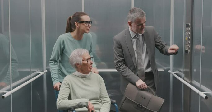 Diverse people talking in the elevator