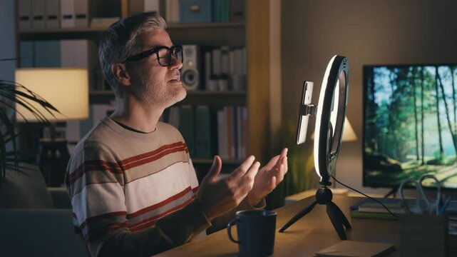 Youtuber recording a video content using his smartphone