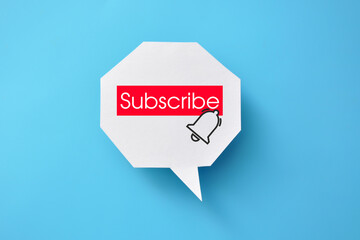The dialog cloud is a bell icon with subscribe written on it. An online channel subscription symbol and a subscription reminder