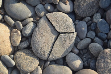 many stones ground off by the water, Milford Sound, Promenade des Anglais in Nice. Popular promenade in the resort town of Pakistan. People are sunbathing on the beach.Smooth stones, pebbles texture