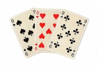 A hand of three decorative playing cards on a white background.