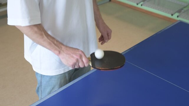 Two people playing table tennis. Man and woman compete in ping pong club