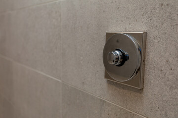 A Modern Shower Control Valve on a Textured Wall enhances both aesthetics and functionality