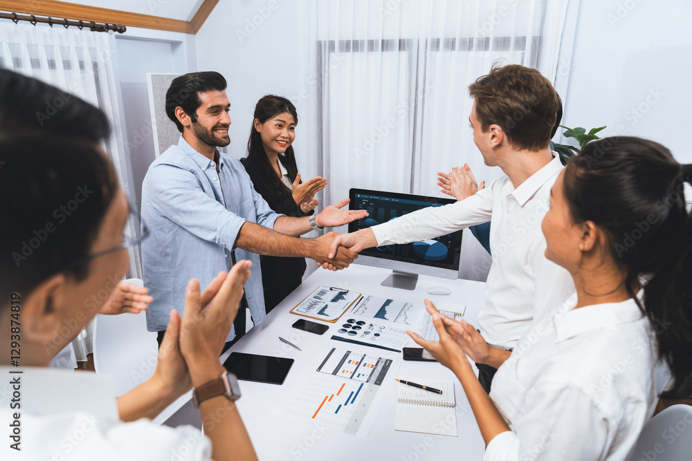 Leinwandbilder Analyst team leader shake hand with his colleague after successful data analysis meeting using FIntech software power with business intelligence or BI dashboard. Prudent