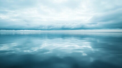 Fototapeta premium Calm Ocean Surface with Mysterious Cloudy Sky Reflection