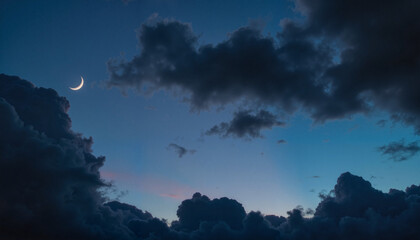 Crescent moon and star shine through dramatic clouds, cosmic wonder