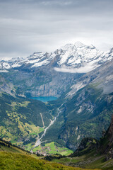 Above Kandersteg village and Oeschinensee ( Oeschinen Lake ) from the Bunderspitz (2546m). Kandersteg is surrounded by high mountains, Bernese Alps, Switzerland.