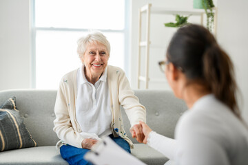 Fototapeta premium old woman thinking with psychologist in consultation office for mind, evaluation or assessment.
