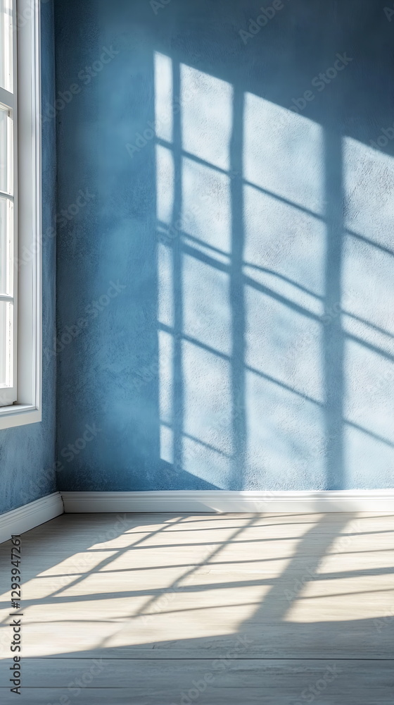 Poster horizontal shadows from a large window crossing soft blue wall. neutral light filling simple, empty 