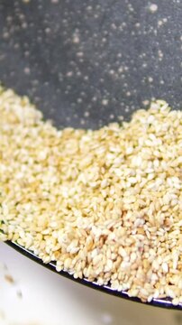 sesame seeds in small glass bowl, closeup, 4k, parallax shot.