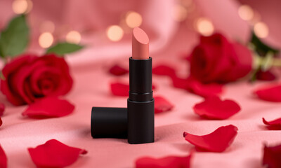A matte black lipstick tube mockup with a soft-focus bokeh background