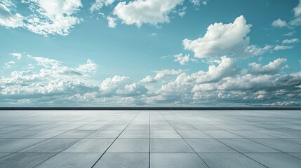 Serene Open Space Under Bright Blue Sky with Fluffy White Clouds
