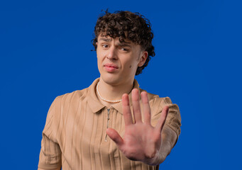 No, never, curly haired man rejecting gesture, stop hand. Ban, timeout.