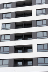 New apartments in a block of flats in the city. Modern apartment view from the outside.