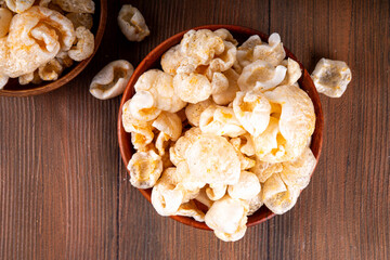 Cracklings or skwarki, fragrant crispy snack made from fried skin of the pork with spices. British,...