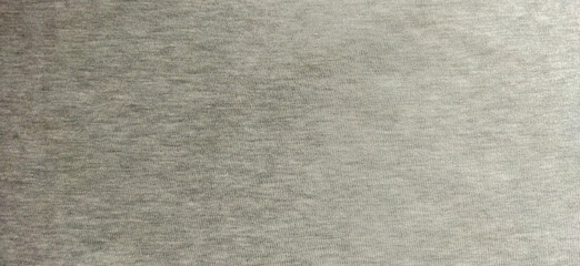 Fototapeta premium A close-up of a neutral gray textile texture, showcasing a subtle woven design, ideal for backgrounds or graphic designs.