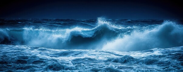 Obraz premium A breathtaking aerial view captures a powerful wave breaking on the ocean's surface under a starry night.