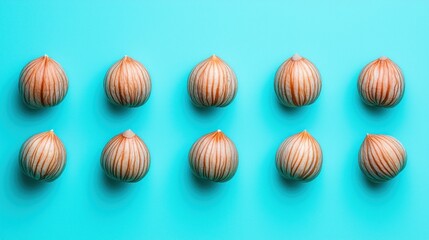 Geometric arrangement of nuts on teal background