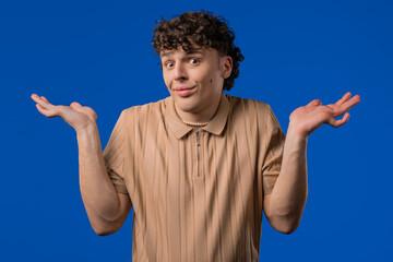 Ignorant mature 30s man, shoulders up - can't help, makes gesture I dont know