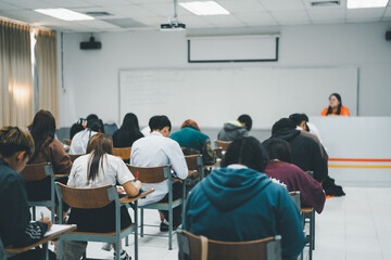 University Students Taking an Exam in a Classroom