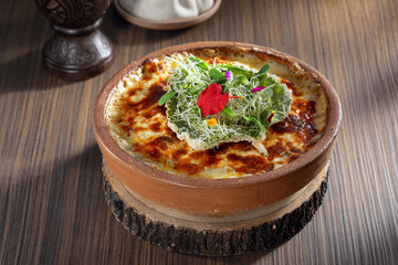 close up view of nice yummy lasagna on grey table