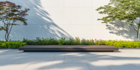 Modern outdoor seating area with lush greenery and clean architecture in daylight