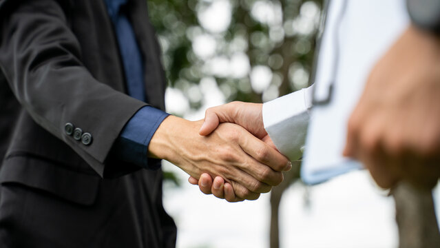 Businessman handshake for teamwork of business merger and acquisition,successful negotiate,hand shake,two businessman shake hand with partner to celebration partnership and business deal concept