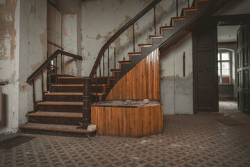 old historic ornamental staircase in abandoned building. carpentry work, balustrade on stairs,...