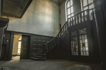 old historic ornamental staircase in abandoned building. carpentry work, balustrade on stairs, wooden buildings