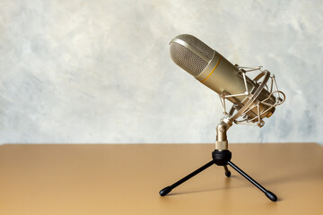 Close up of metal microphone on the desk. On the air concept
