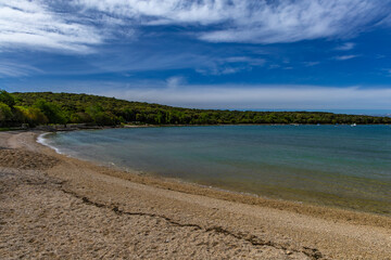 Wild beaches without people, a moment before the storm and storm on the Adriatic Sea, around Rovinj, Istrian heavy sky with clouds, rough waves, wild nature