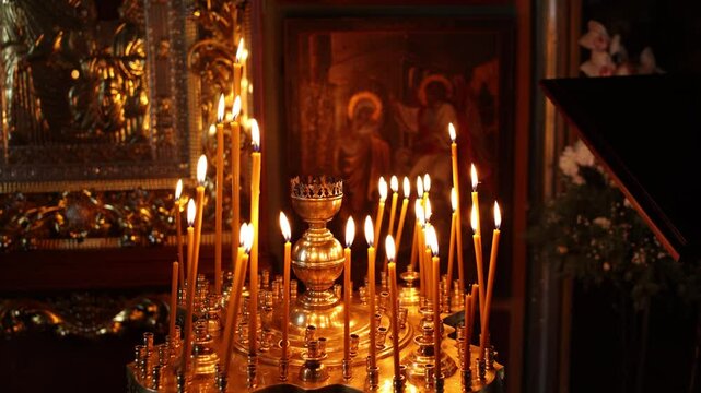 candles are burning in the orthodox church in the middle