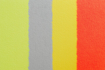Fototapeta premium Textured background featuring pastel colors in stripes, including green, gray, yellow, and red, creating vibrant and modern aesthetic